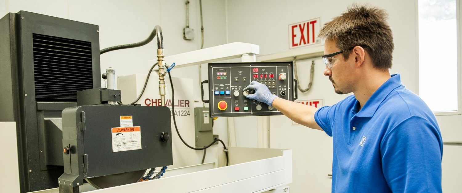 man using a manufacturing machine